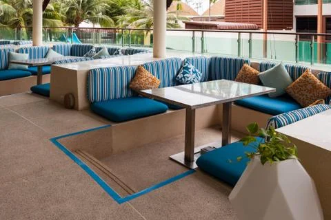 Restaurant dining table and pillow on terrace outside Foto stock