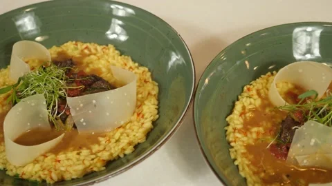 Restaurant dish - delicious risotto with vegetables and tender veal meat Stock Footage 240002803