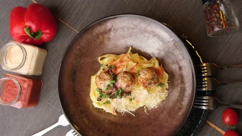 Restaurant dish. pasta with round cutlets in pork sauce. Tasty dish. filming Stock Footage 149827170