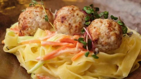 Restaurant dish. pasta with round cutlets in pork sauce. Tasty dish. close-up. Stock Footage 149980136