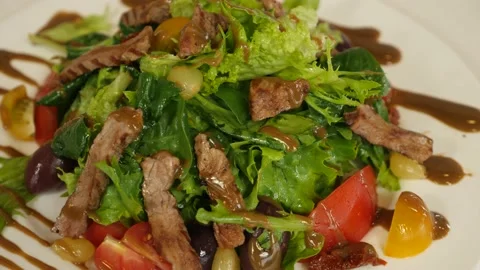 Restaurant dish - vegetable mix with tender veal meat Stock-Footage 239945617