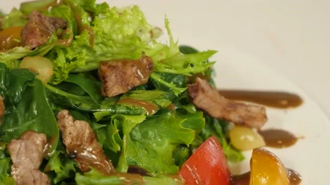 Restaurant dish - vegetable mix with tender veal meat Stock Footage 239945628