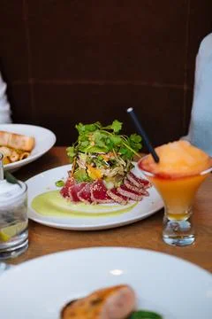 Restaurant dishes with drinks on table Stock Photos