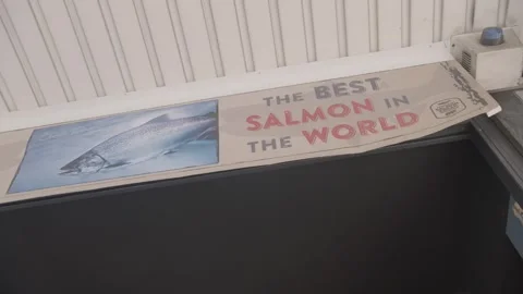 Restaurant Exterior Sign Featuring Fish Image and Bold Seafood Promotion Stock Footage 345677560