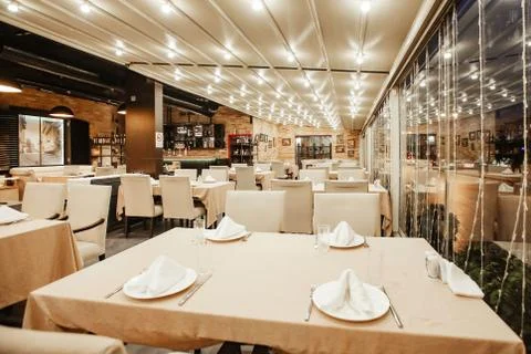 Restaurant hall with lots of table Stock Photos