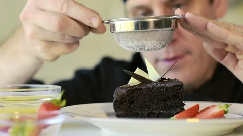 Restaurant hotel private chef preparing desert chocolate cake Stock Footage 66584260