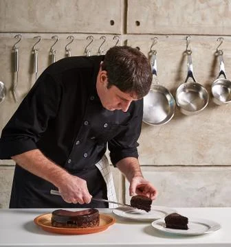 Restaurant hotel private chef preparing desert chocolate cake Stock Photos