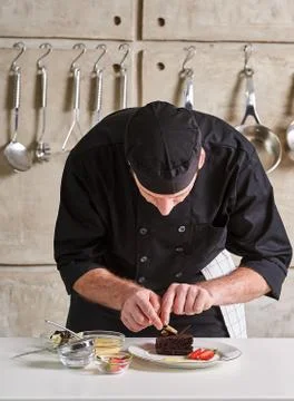 Restaurant hotel private chef preparing desert chocolate cake Stock Photos