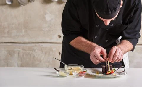 Restaurant hotel private chef preparing desert chocolate cake Stock Photos