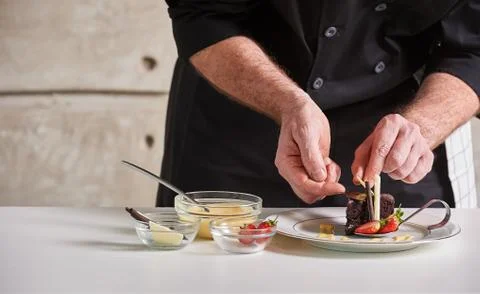 Restaurant hotel private chef preparing desert chocolate cake Stock Photos
