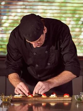 Restaurant hotel private chef preparing making canapes starters snacks Stock Photos