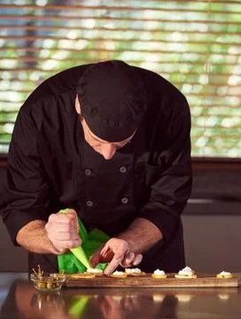 Restaurant hotel private chef preparing making canapes starters snacks Stock Photos