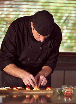 Restaurant hotel private chef preparing making canapes starters snacks Stock Photos