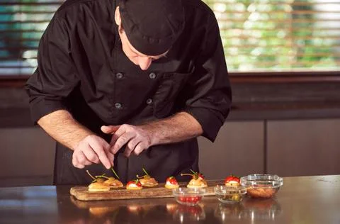 Restaurant hotel private chef preparing making canapes starters snacks Stock Photos
