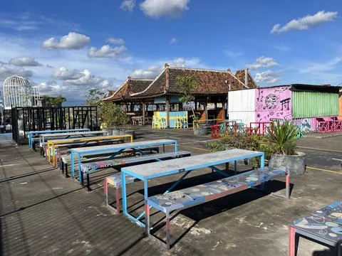 Restaurant interior featuring metal table and chair with panoramic view Stock Photos
