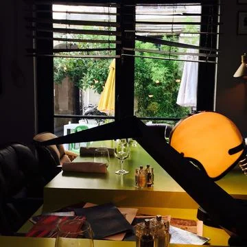 Restaurant interior with table setting and window light in Paris Stock Photos