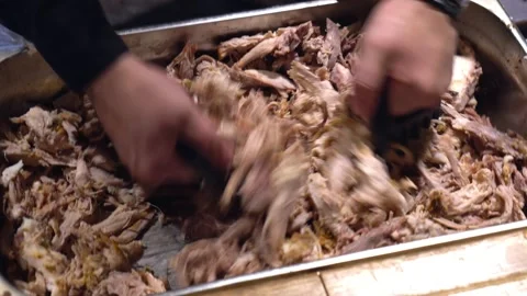 Restaurant kitchen, chef cuts boiled meat for salad with a knife. Beef, pork Stock Footage 171682346