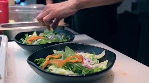 Restaurant kitchen. The chef prepares a salad of vegetables. Healthy eating Video stock 171682672