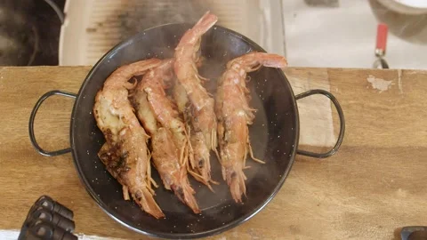 Restaurant kitchen chef preparing flamb shrimps, close-up detail. (A) Stock Footage 165046813