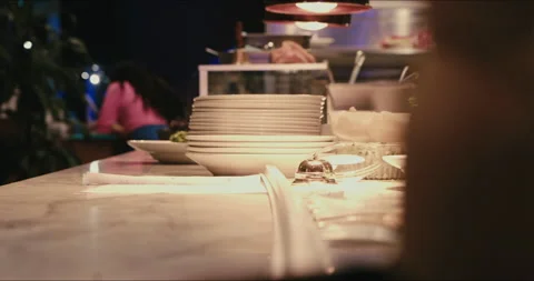 Restaurant kitchen, chef rings bell for service Stock Footage 204072125