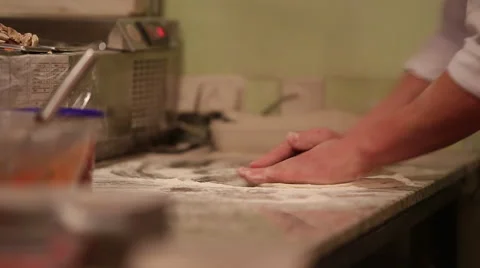In a restaurant kitchen knead dough hands Stock Footage 44219016