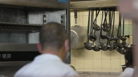 Restaurant kitchen ladles hanging Stock Footage 208537650
