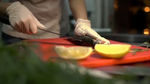 Restaurant kitchen. Professional chef is cooking fish. Close-up. Stock Footage 84037187