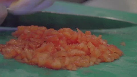 Restaurant kitchen slicing tomatoes Stock Footage 109135237
