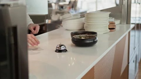 Restaurant Kitchen Staff Ringing Bell Passing Fine Dining Dishes to Server Stock Footage 309013563