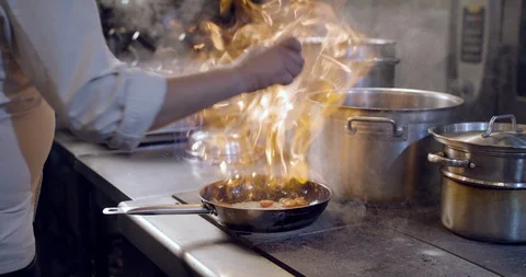 Restaurant kitchen tomatoes on fire 2 Stock Footage 121928317