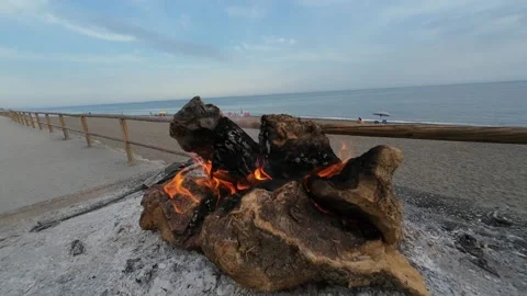 Restaurant log fire on beach promenade in Costa del Sol Stock Footage 345037660
