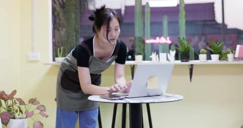 The restaurant manager is surfing the web . standing in a coffee cafe Stock Footage 172283039