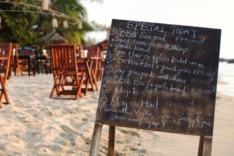 Restaurant menu board on the beach Stock Photos