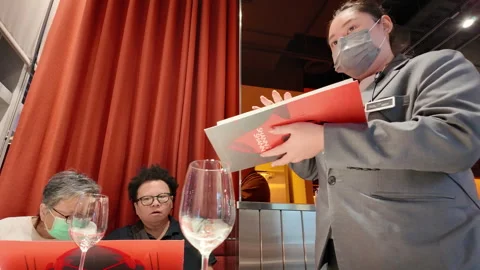Restaurant Menu Highlights: Waitstaff Recommends Best Dishes to Our Family Stock Footage 292130496