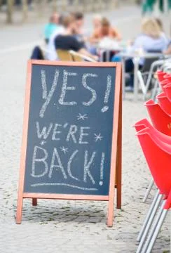 Restaurant or cafe display announcing reopening business after corona lockdown Stock Photos