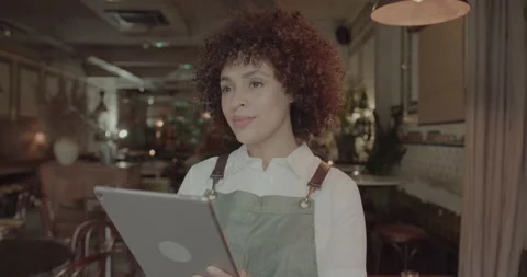 Restaurant owner working on Digital tablet Stock Footage 221987016