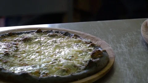 A restaurant. Pizzeria. In the kitchen on the table are three ready-made pizzas Stock Footage 84832053