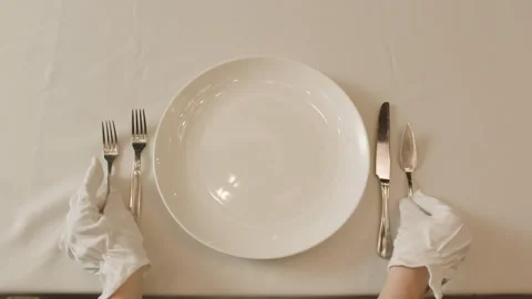 Restaurant professionals setting up the table and the cutlery Stock Footage 283029956