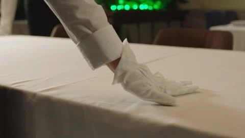 Restaurant professionals setting up the table with gloves Stock Footage 283027978