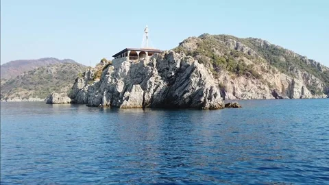 Restaurant in a remote location on mountain rock in the sea. Rock Restaurant Stock Footage 236917397