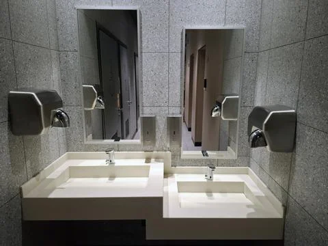 Restaurant restroom interior with two sinks and mirrors Fotos Stock