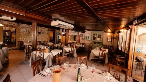 Restaurant room with set tables Stock Footage 87761002