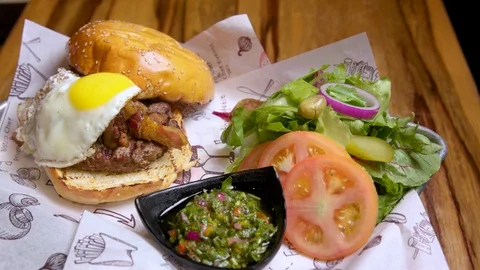 Restaurant serving hamburger with egg Stock Footage 95866316