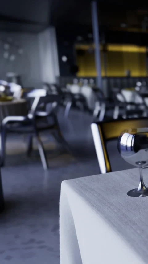 Restaurant setting with table and glass waiting for guests in evening Stock Footage 332213883