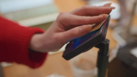 Restaurant staff assisting customers quickly during busy hours. Patron uses Stock Footage 345171691