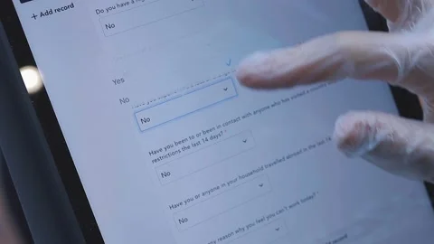 Restaurant staff using the Covid Trail App on a tablet Stock Footage 151014787