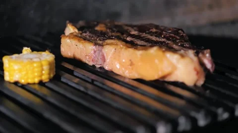 In the restaurant. steak and corn grilled Stock Footage 221118970