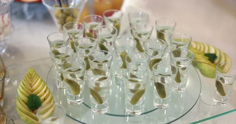 Restaurant. Table. Buffet. Drinks. Vodka with cucumber. Video stock 51448209