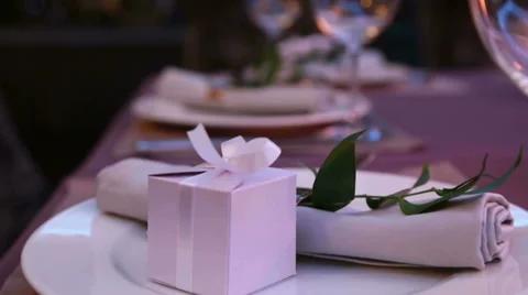 Restaurant table layout with nice presents for a romantic dinner Stock Footage 68892611