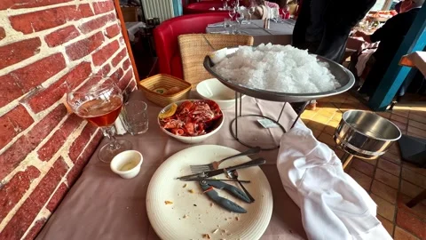 Restaurant table presenting seafood platter, cracked ice and beverage Stock Footage 333722737